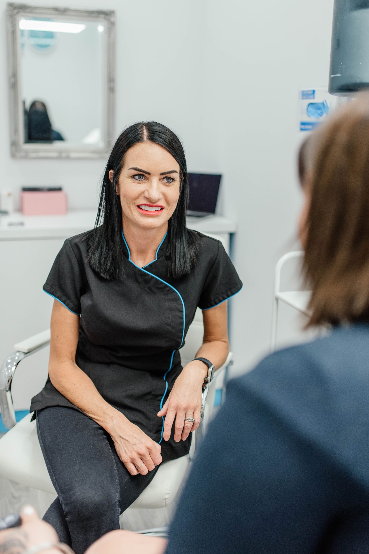 Becky Colwill consulting with a patient at the clinic